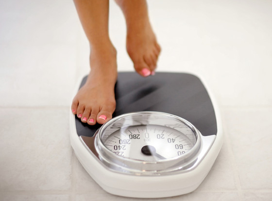 Woman on Scale, New Year's Resolution Woman on Scale, New Year's Resolution